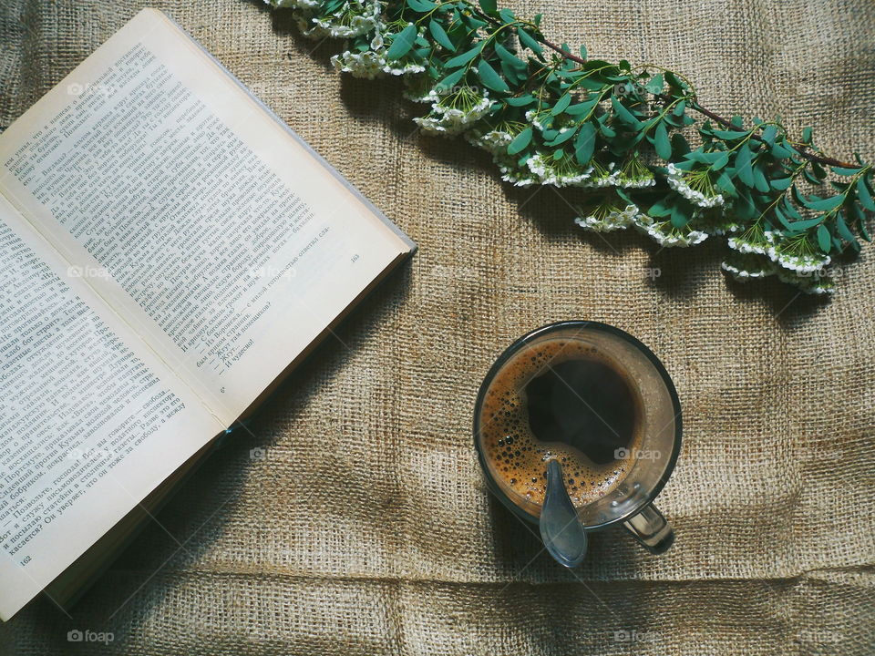 Coffee, flowers and a favorite book