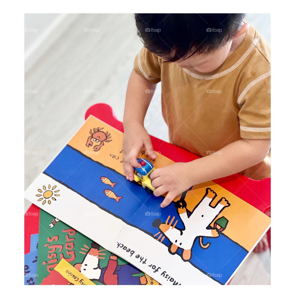 Asian kid with maisy illustration sticker book 