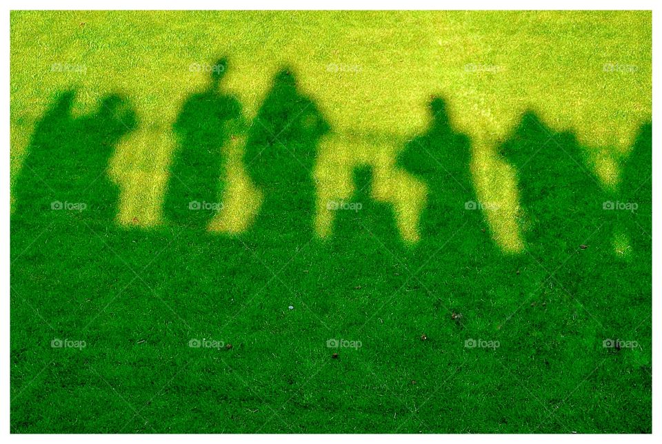 silhouettes of people on the garden grass