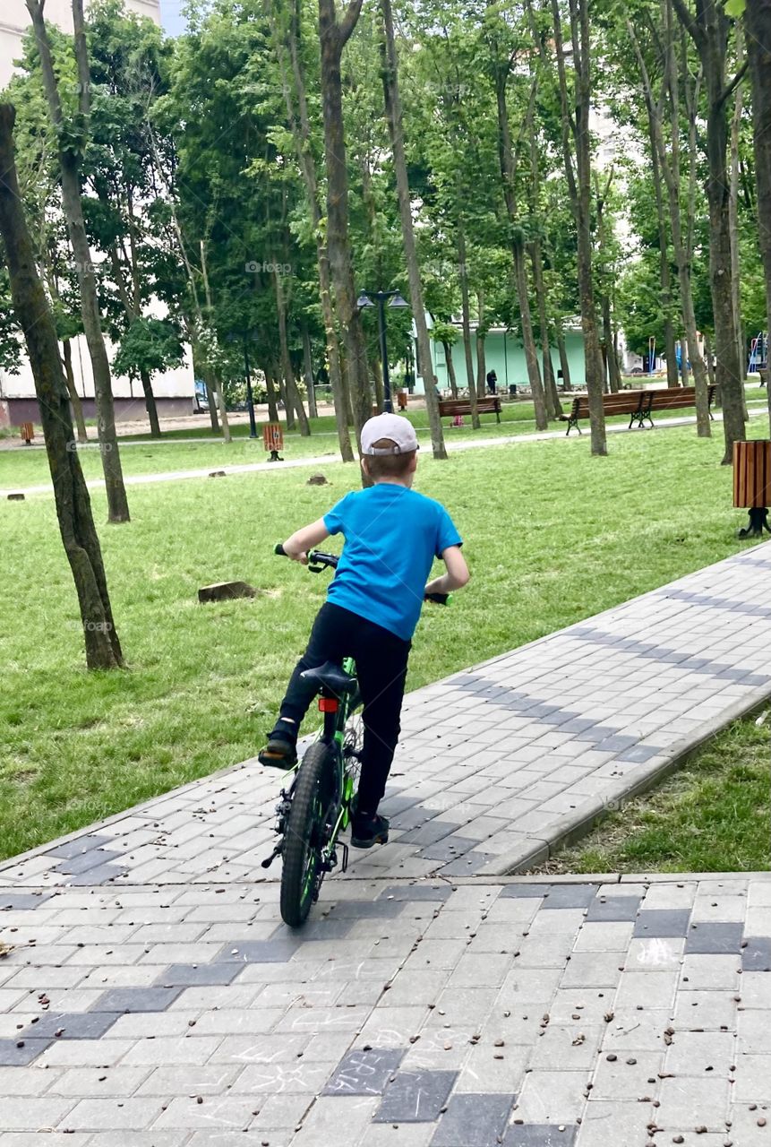 
a boy on a bicycle