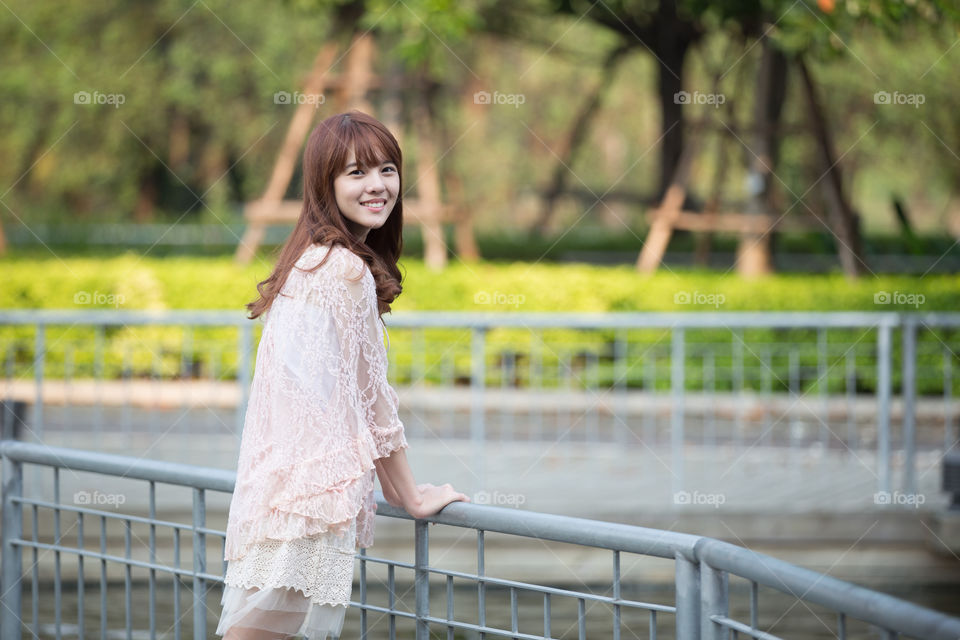 Cute young girl smiling in the park