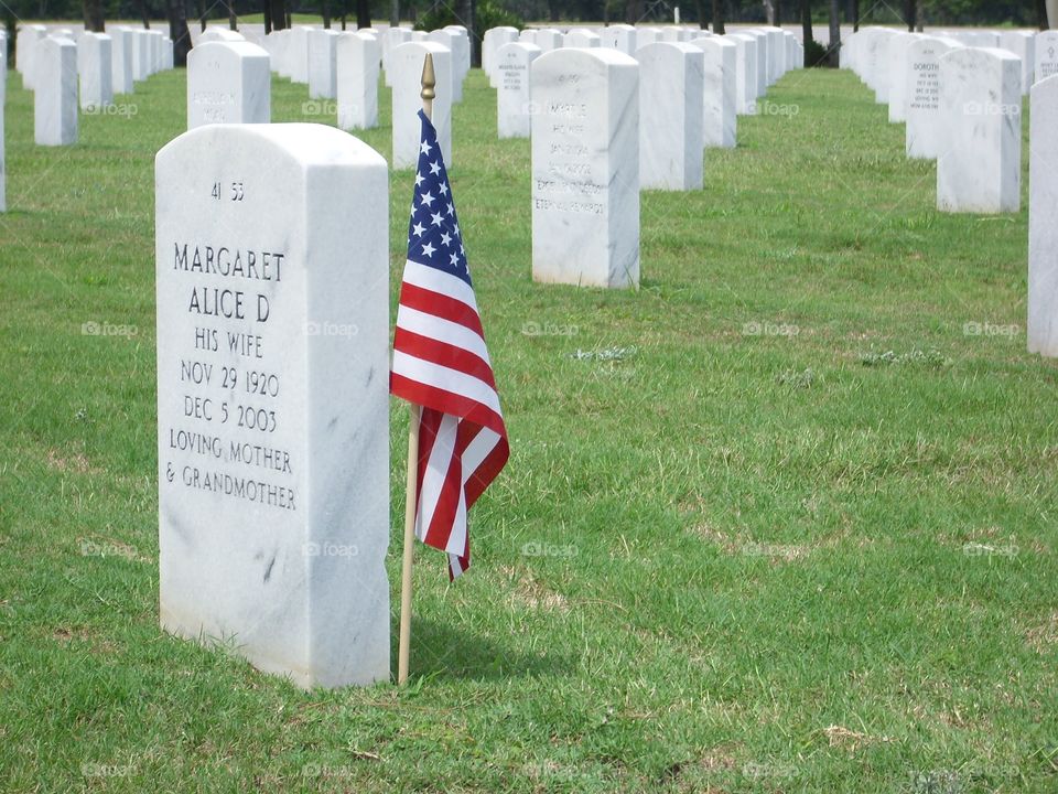 United States flag in a military cemetery next to a headset