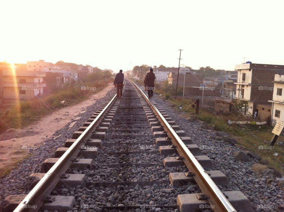 Men walking on the tracks