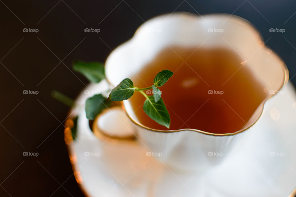Cup Tea with herbal leaf