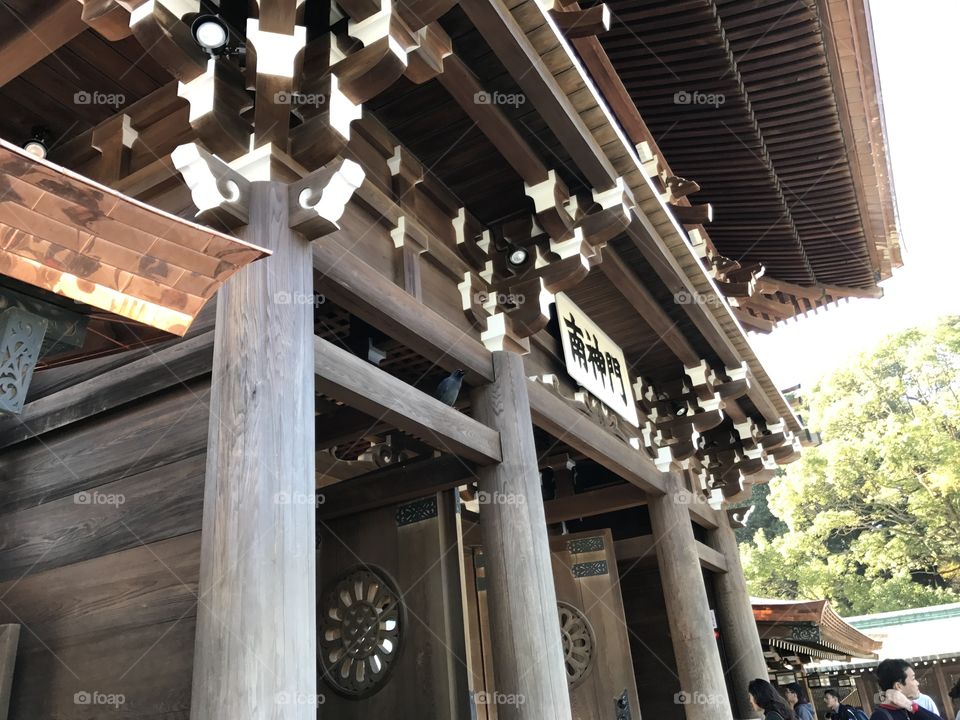 Japan temple, Meiji Shrine, located in Shibuya, Tokyo, is the Shinto shrine that is dedicated to the deified spirits of Emperor Meiji and his wife, Empress Shōken. East gate doors 