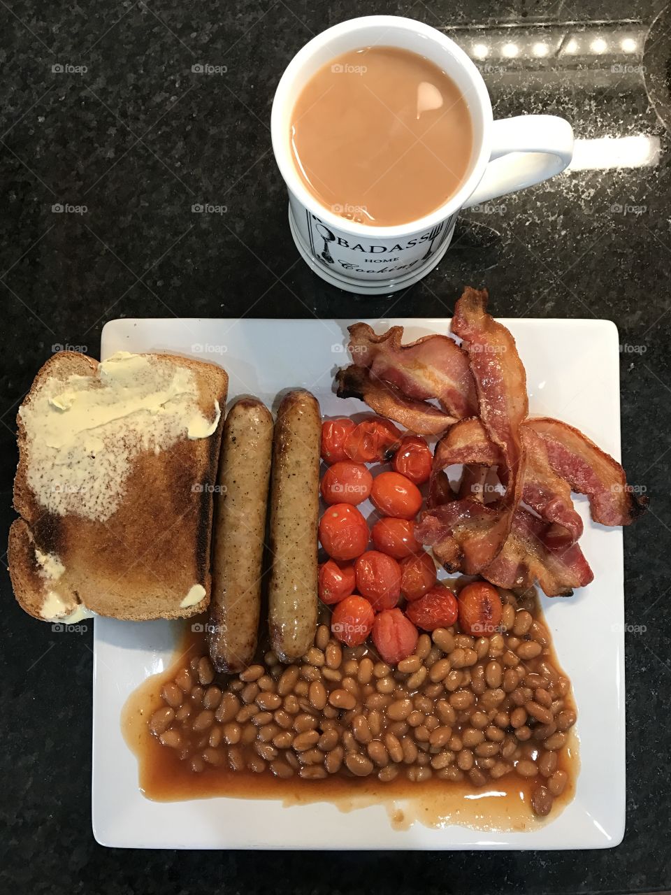 Breakfast bacon sausage beans toast tea