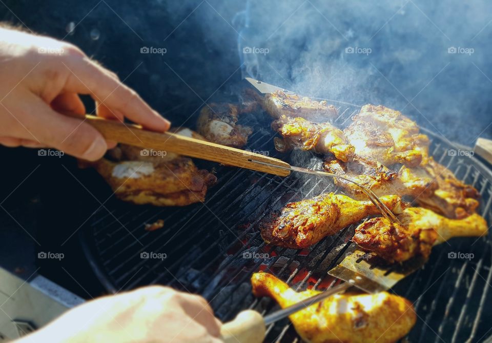 A person preparing barbecue