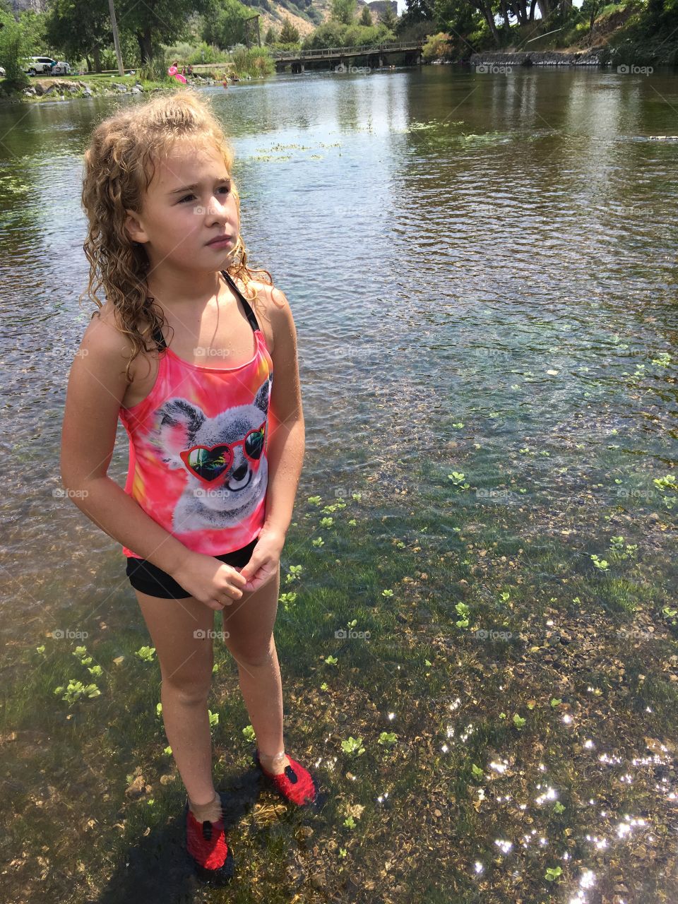 Girl standing in the river.