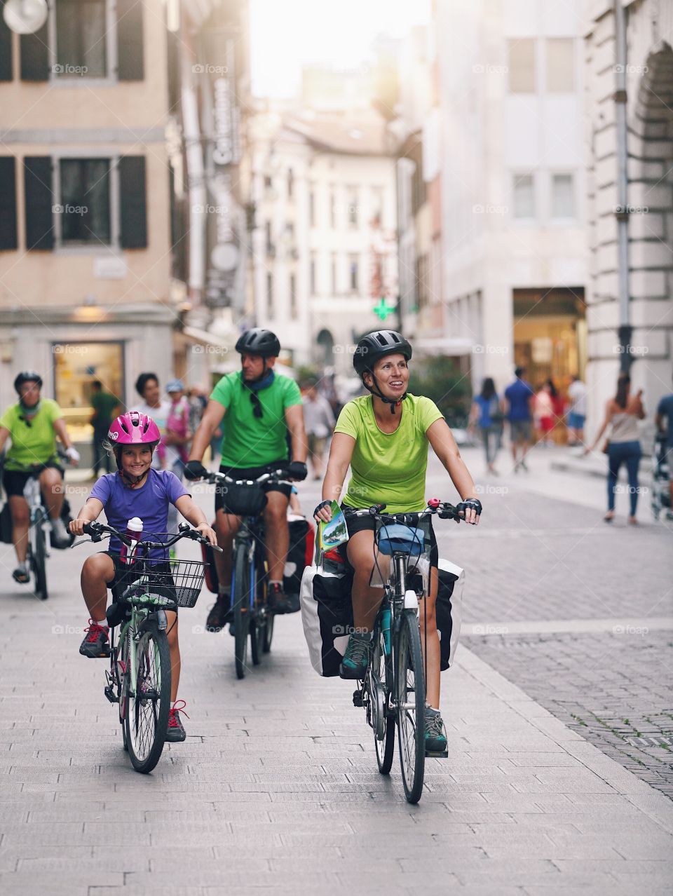 Happy family on bicycles