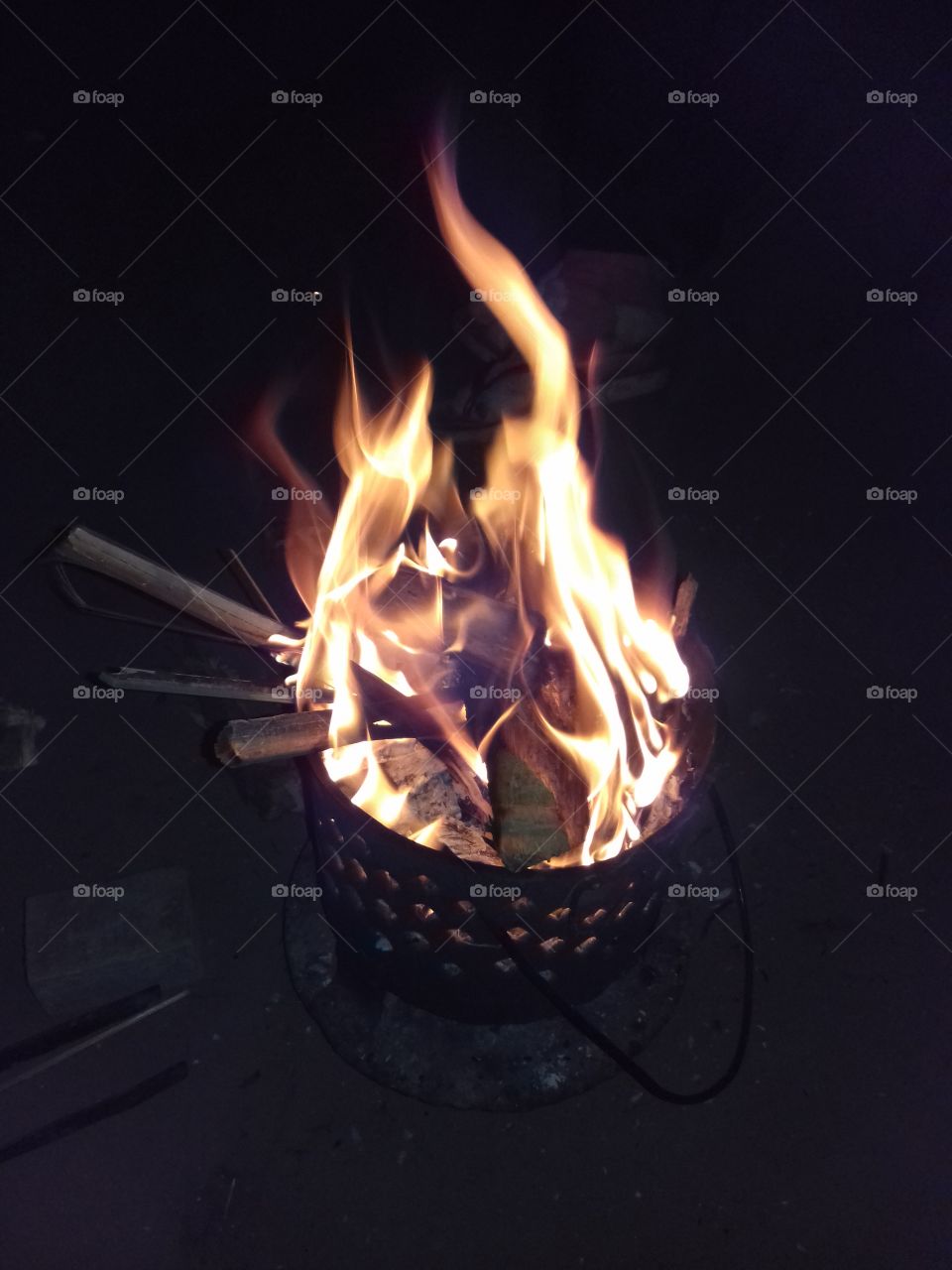 charcoal fire pot lighted with firewood and capture with flash