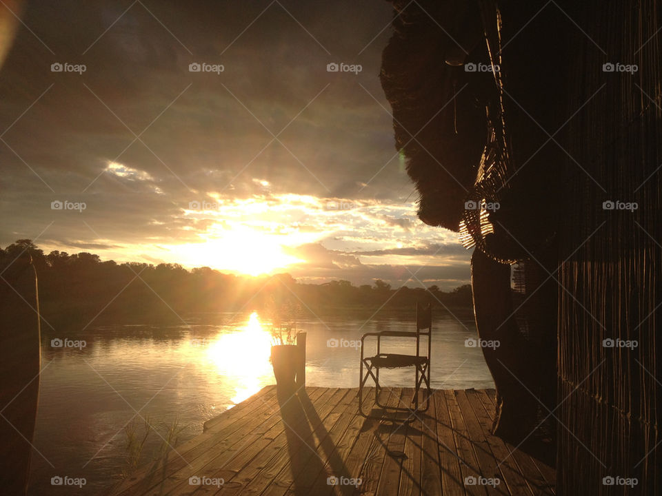 Sunset in a tree house at Zambezi river in Botswana