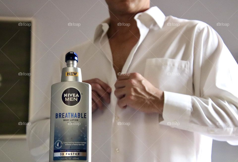 Nivea men breathable with man in background buttoning shirt