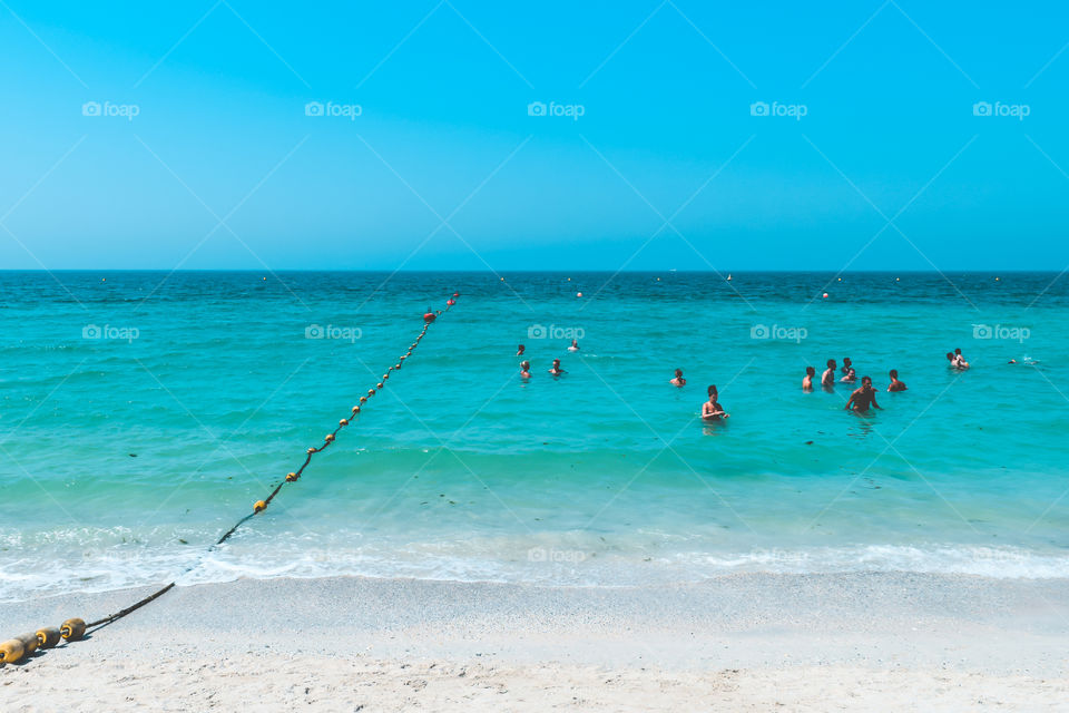 DUBAI, UAE United Arab Emirates - 23 APRIL 2016:View of Public beach with turquoise water in Al Mamzar, popular travel tourism destination in summer vacation for tourist traveler on christmas holiday