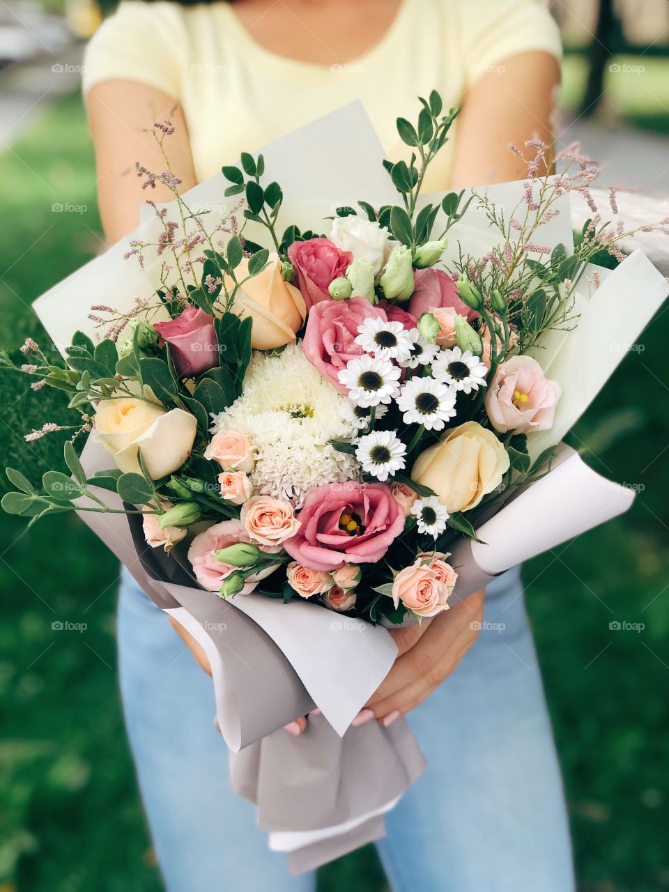 Summer bouquet on woman hand