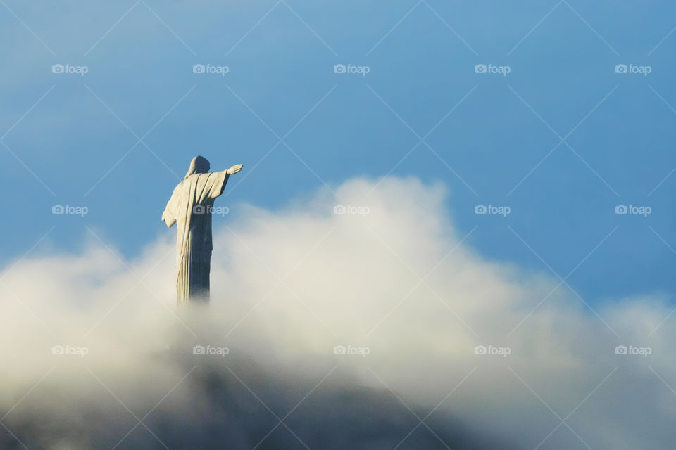 Statue of Christ the Redeemer. The famous icon covered in the clouds