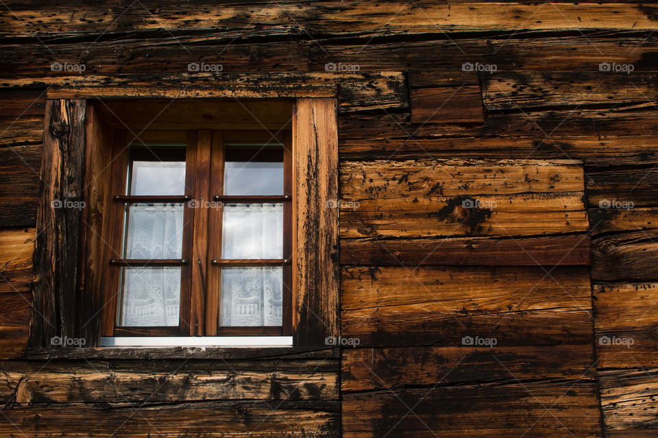 window of an old house in the alps 