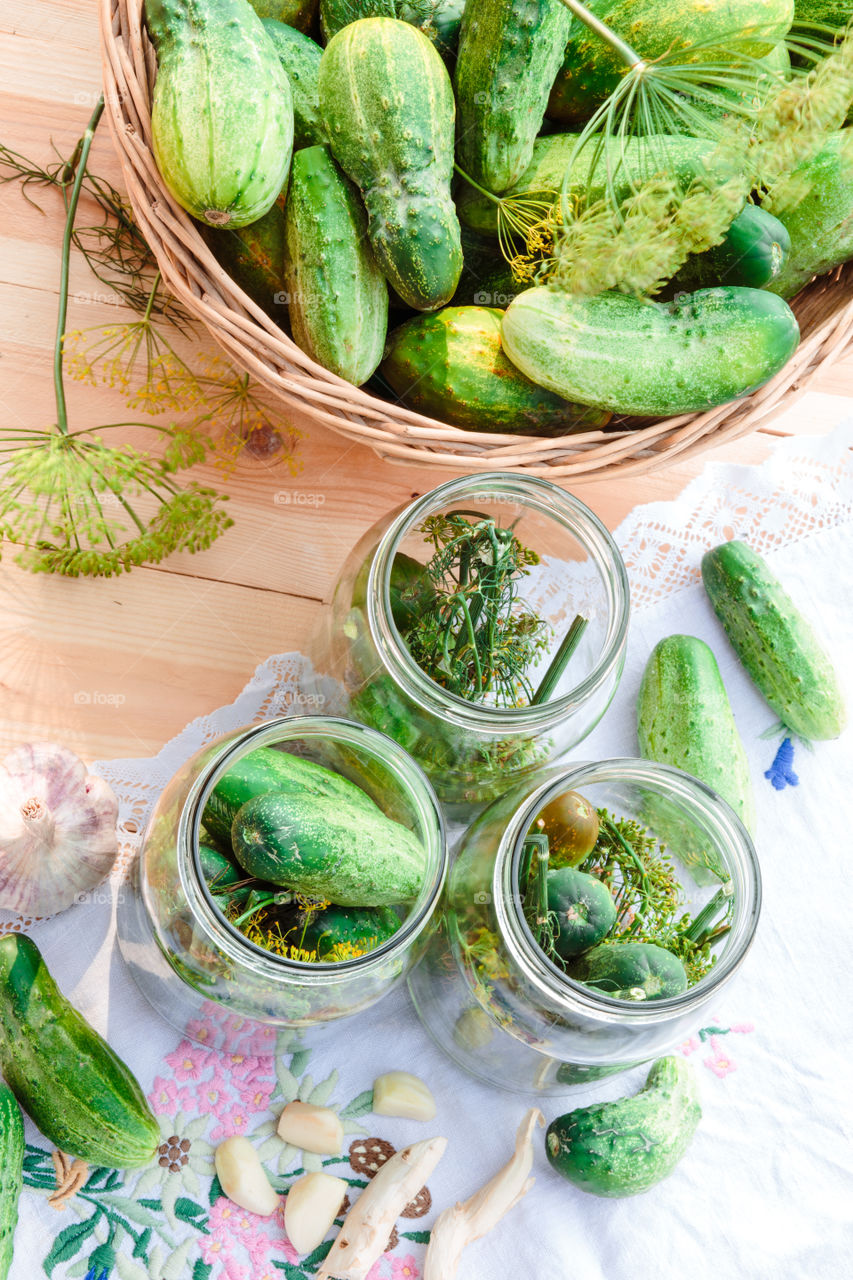 Pickling cucumbers. Pickling cucumbers with home garden vegetables and herbs