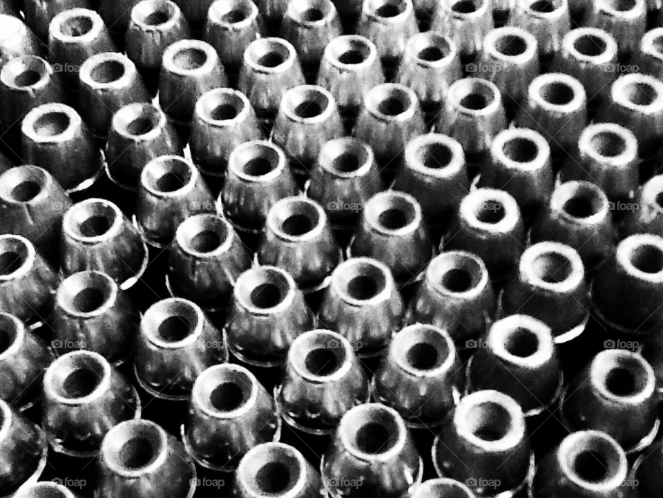 Hollow point bullets gather in close formation to make a very symmetrical and interesting photo. 