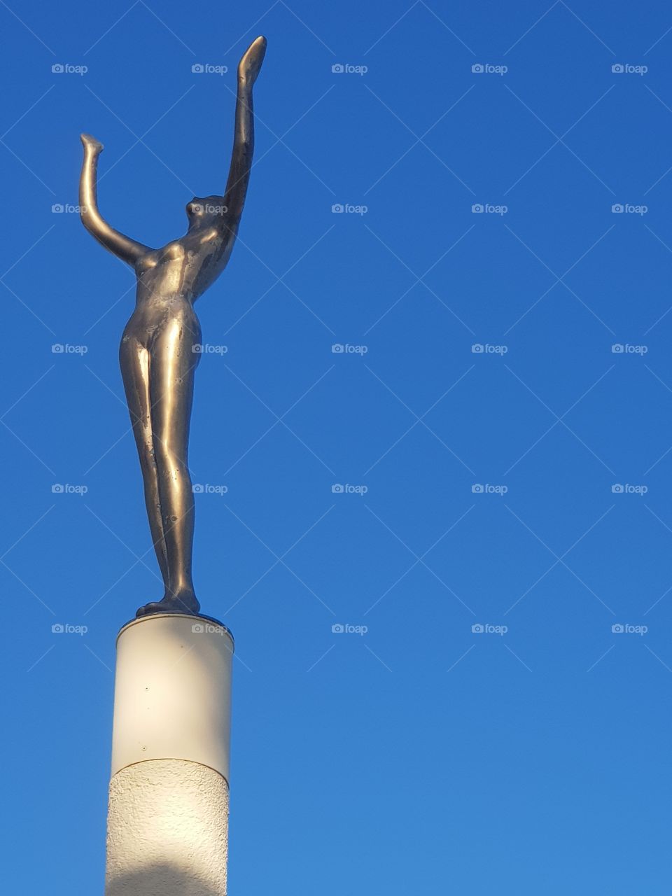 In our town of Napier is a lady her hands reaching for the sky. May we receive love and blessings from the universe.