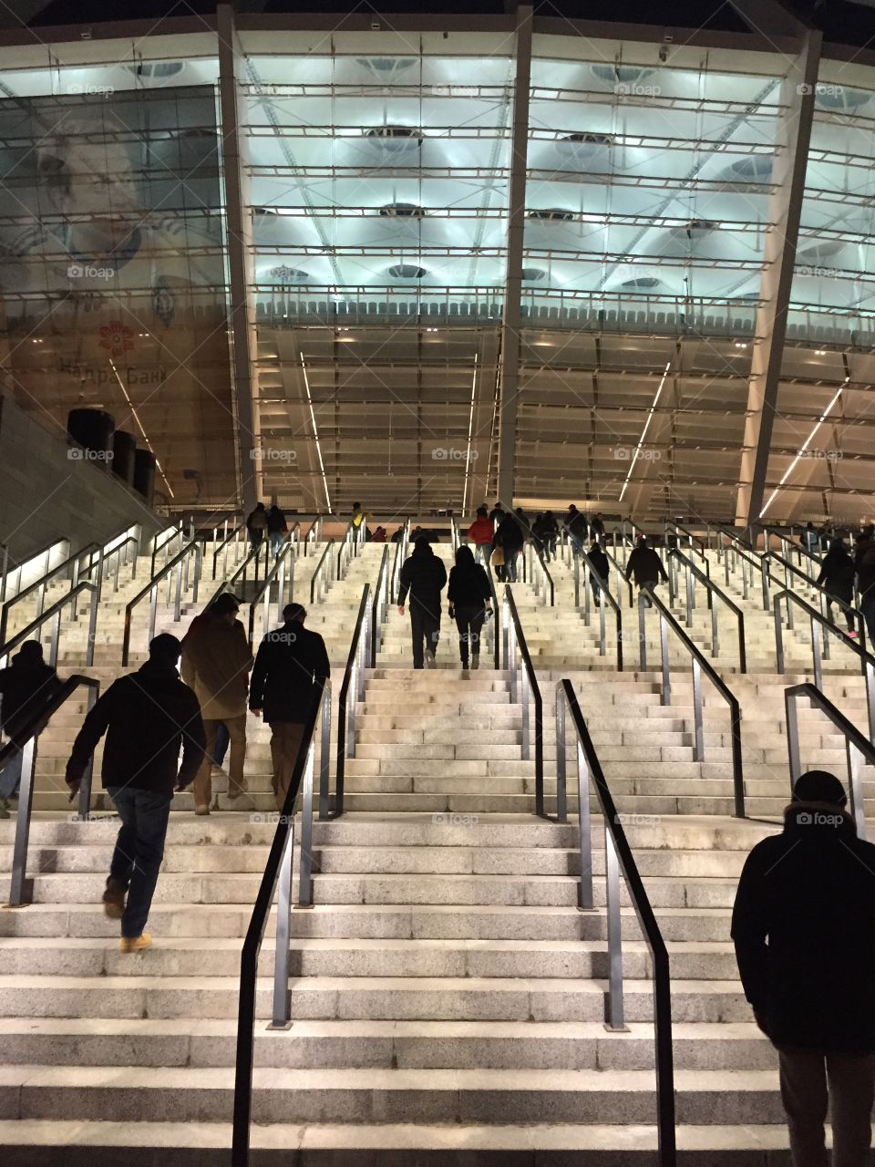 Taking a staircase to the football game on a stadium 