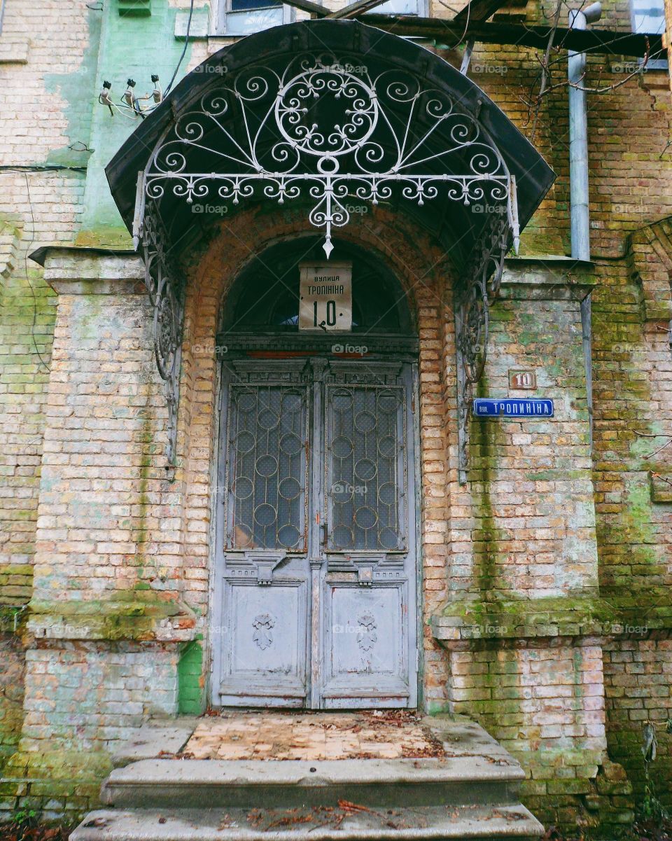 old wooden door in a brick house