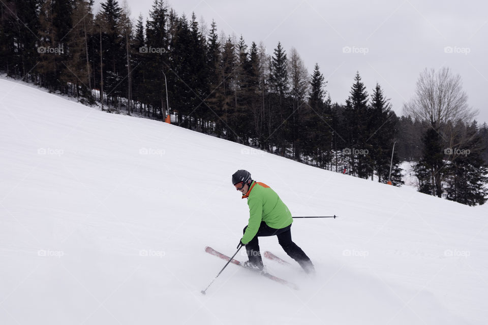 alpine skier on a mountain snow descent