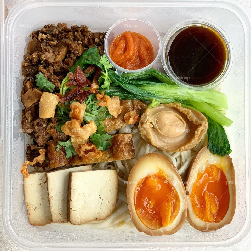 Chargrilled chicken and stewed pork al dente noodles with ramen egg and baby abalone 