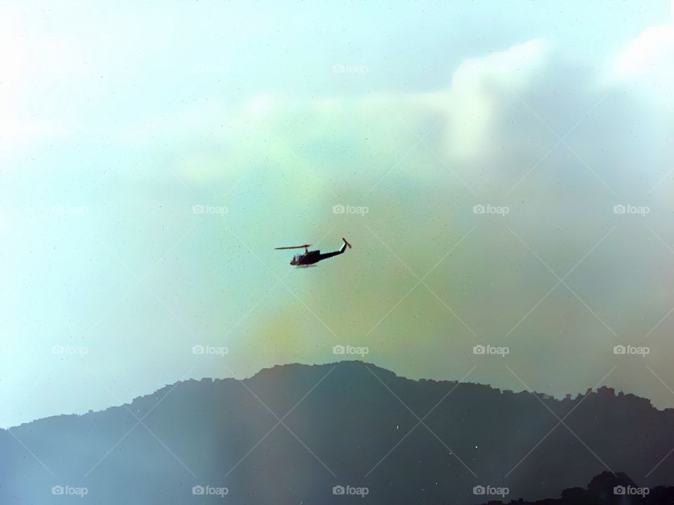Helicopter flying through Doi Tung