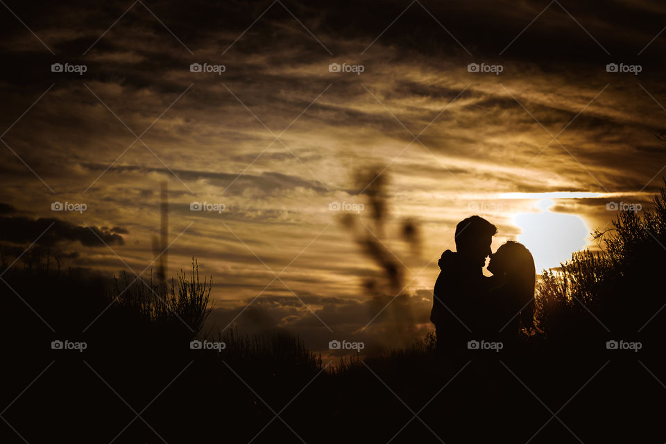 Silhouette of a couple in fading lights