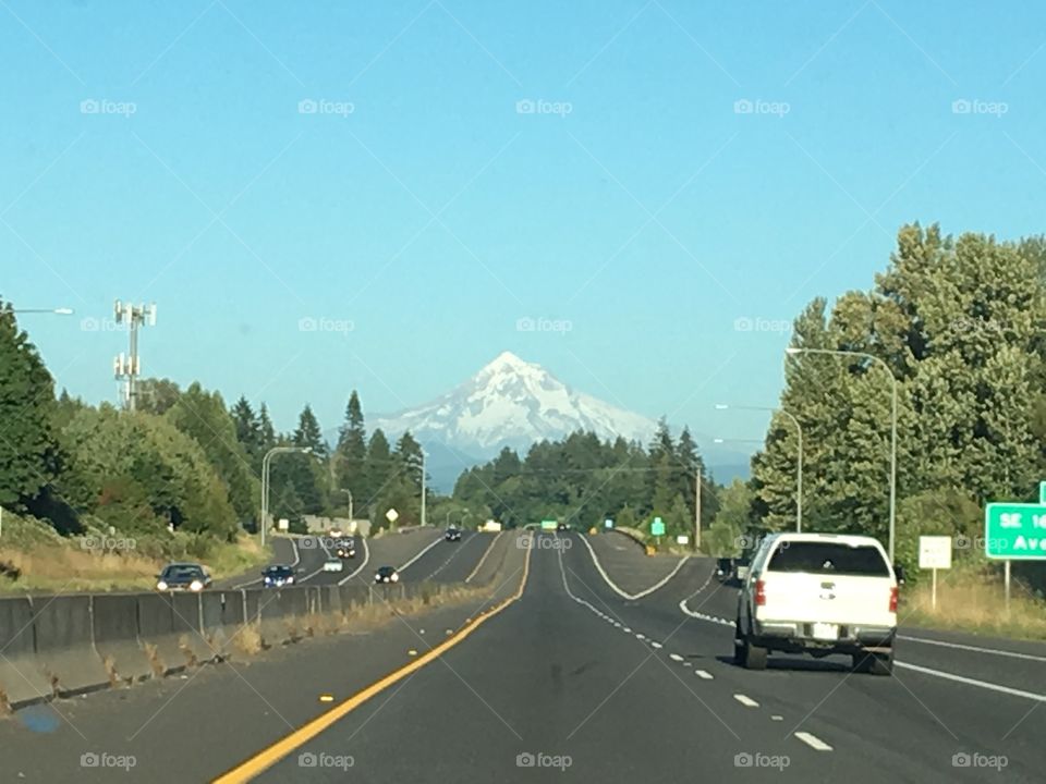 On the expressway of Portland, looking straight ahead at Mount Hood on a clear summer day. 