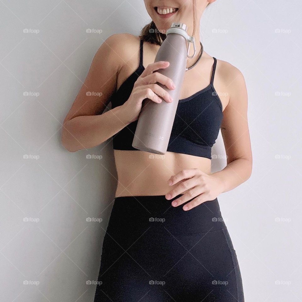 Sporty fitness asian woman with water bottle 