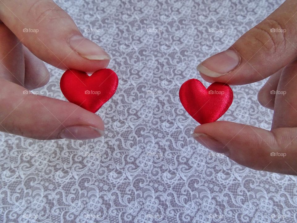 Holding red hearts