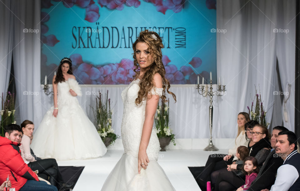 Fashion show at a wedding fair. Here are the latest dresses and clothes for both bride and groom