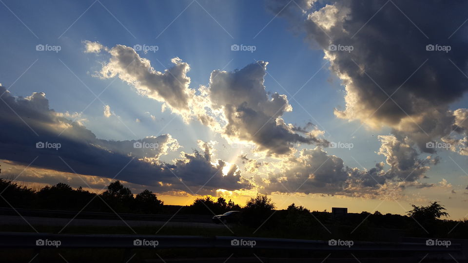 sun rays behind clouds