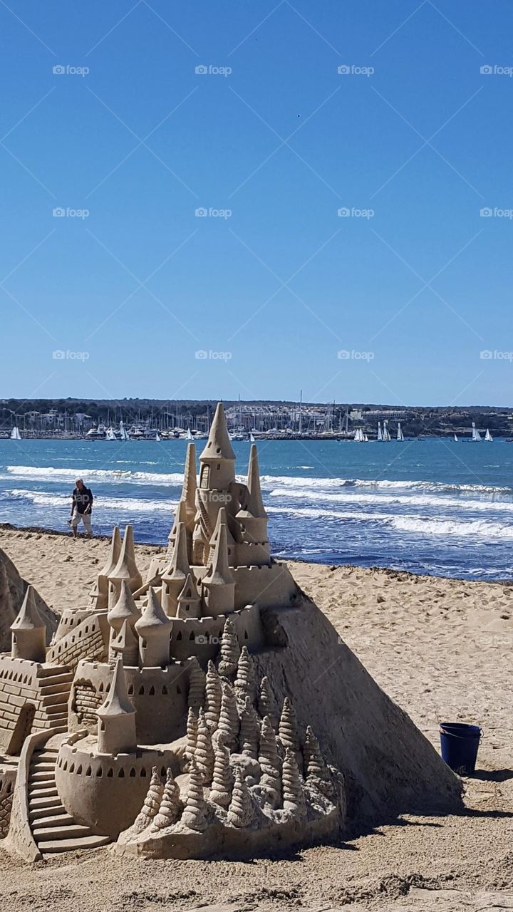 Beautiful sand castle by the sea... Summer day, nice sunny weather.