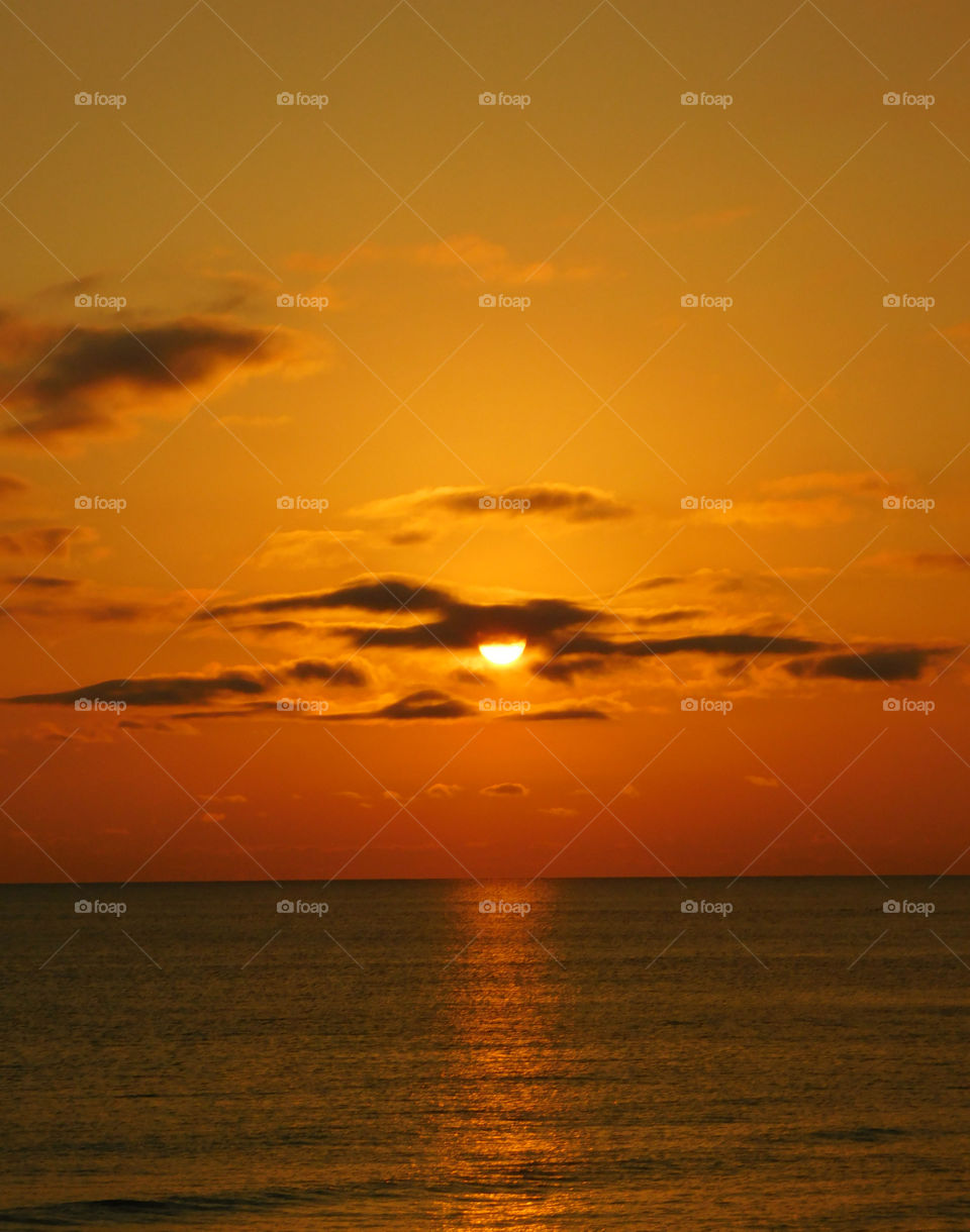 Scenic view of sunset against dramatic sky