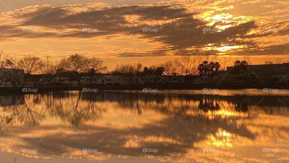 This is a Reflection from Top to Bottom or Top Of Lake Waters. Sunset colors are inviting more from the sunset. 