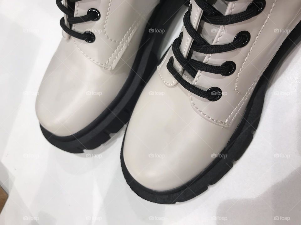 white modern boots with black laces