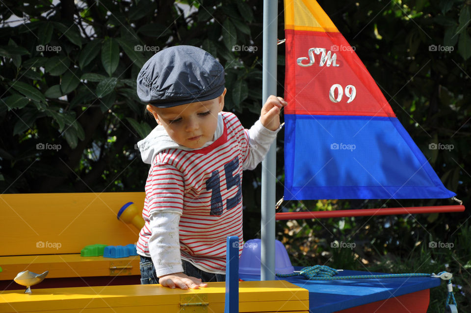 summer child playing sand by nivoa