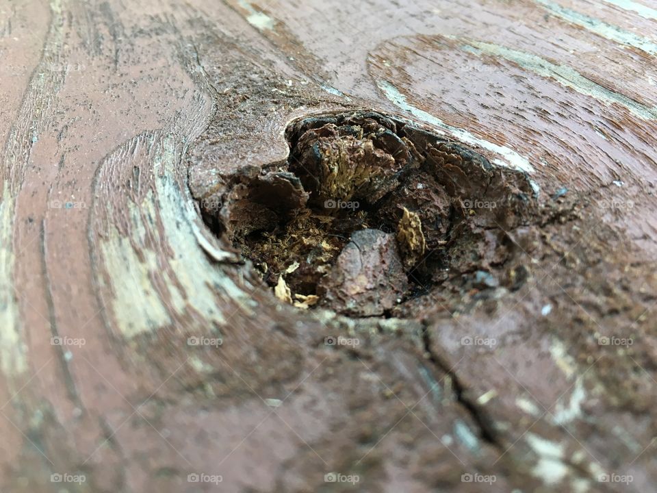Porch-stained wood knot