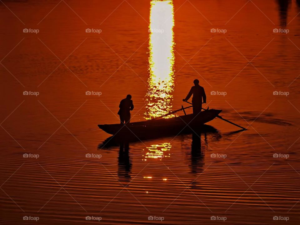 Fishermen in the sunset glow