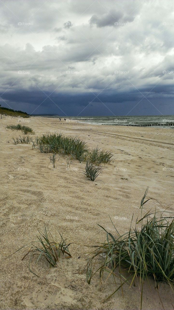 Beach and stormy clouds