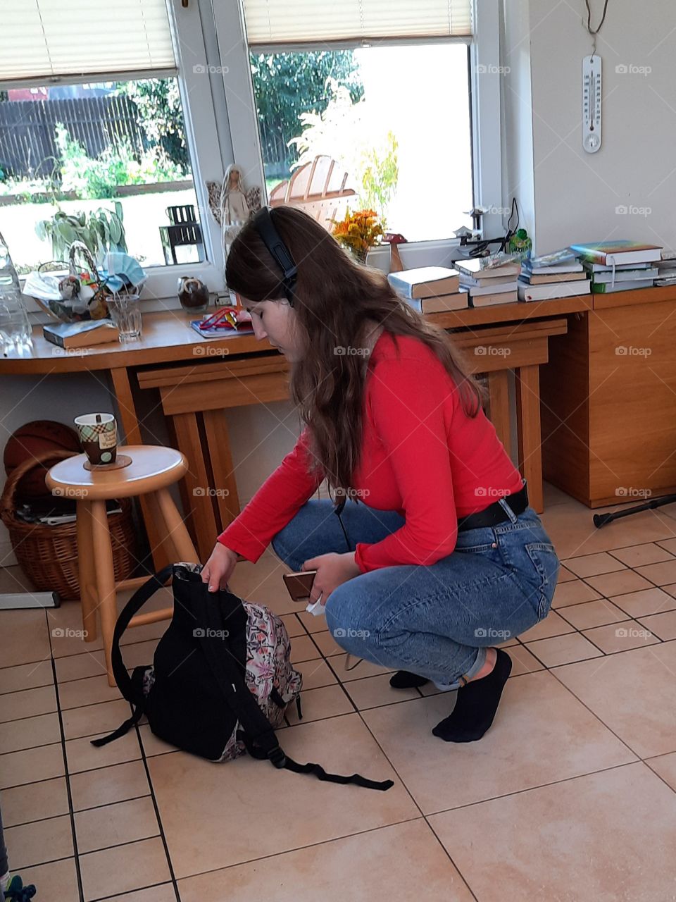 student girl in red getting ready for homework