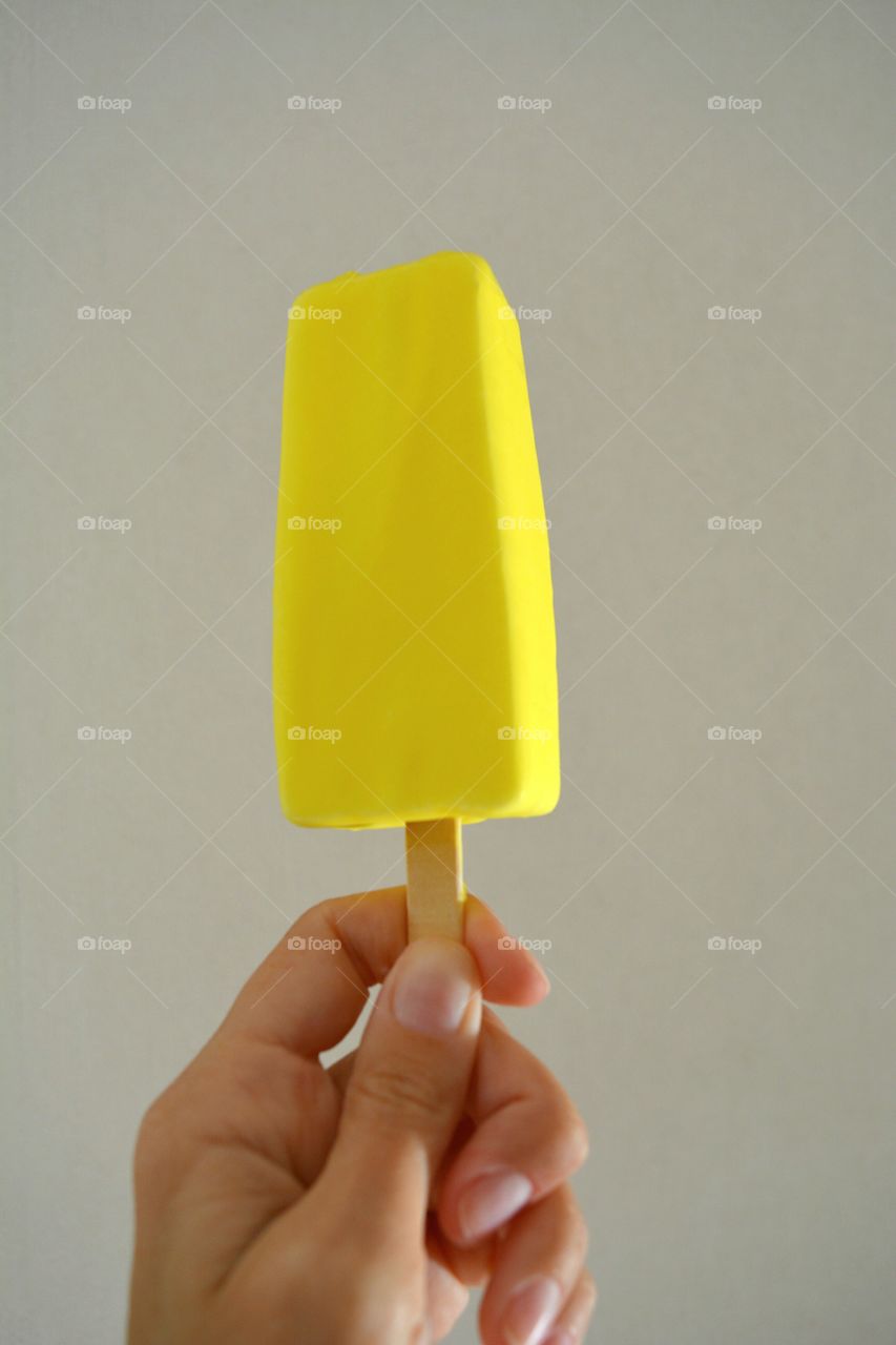 Close-up of hand holding ice cream