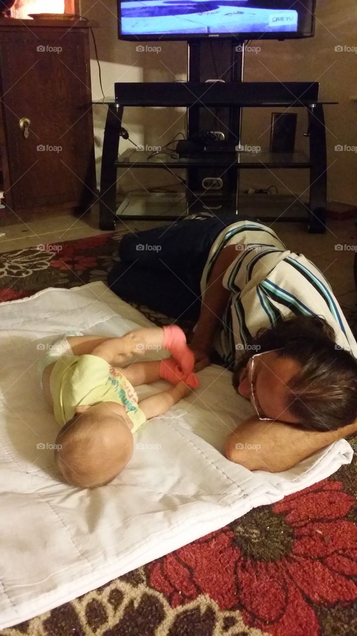 Floor time with Daddy. caught daddy playing on our babies level...nothing makes my heart smile than little moments like these.