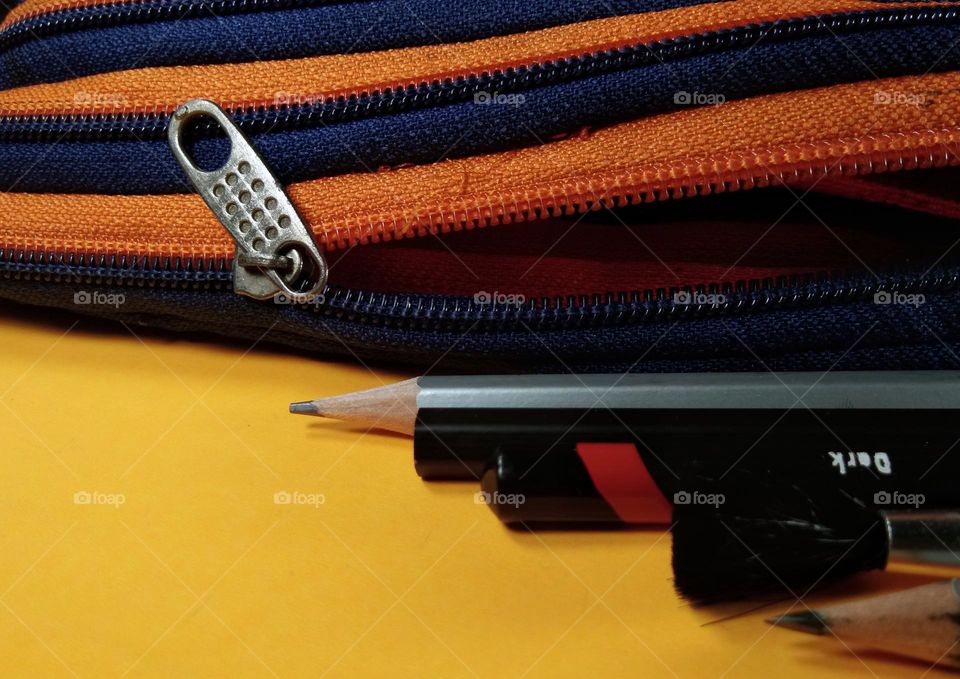 pencil case made from colorful zipper. closeup with pencils