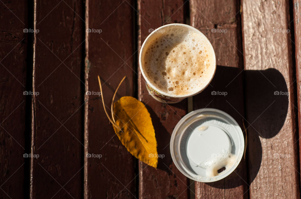 A cup of take away coffee from above 