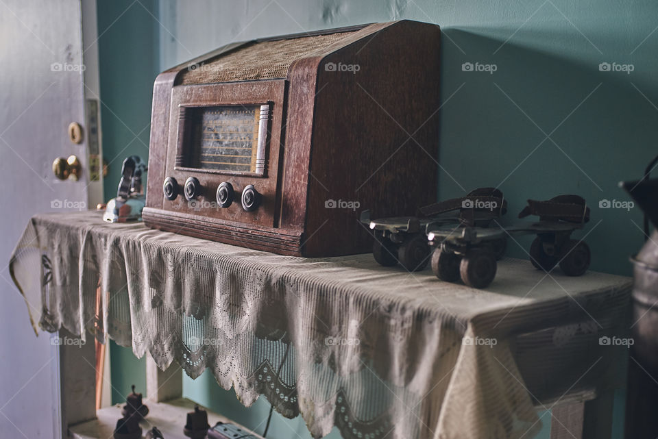 old radio next to some old steel skates