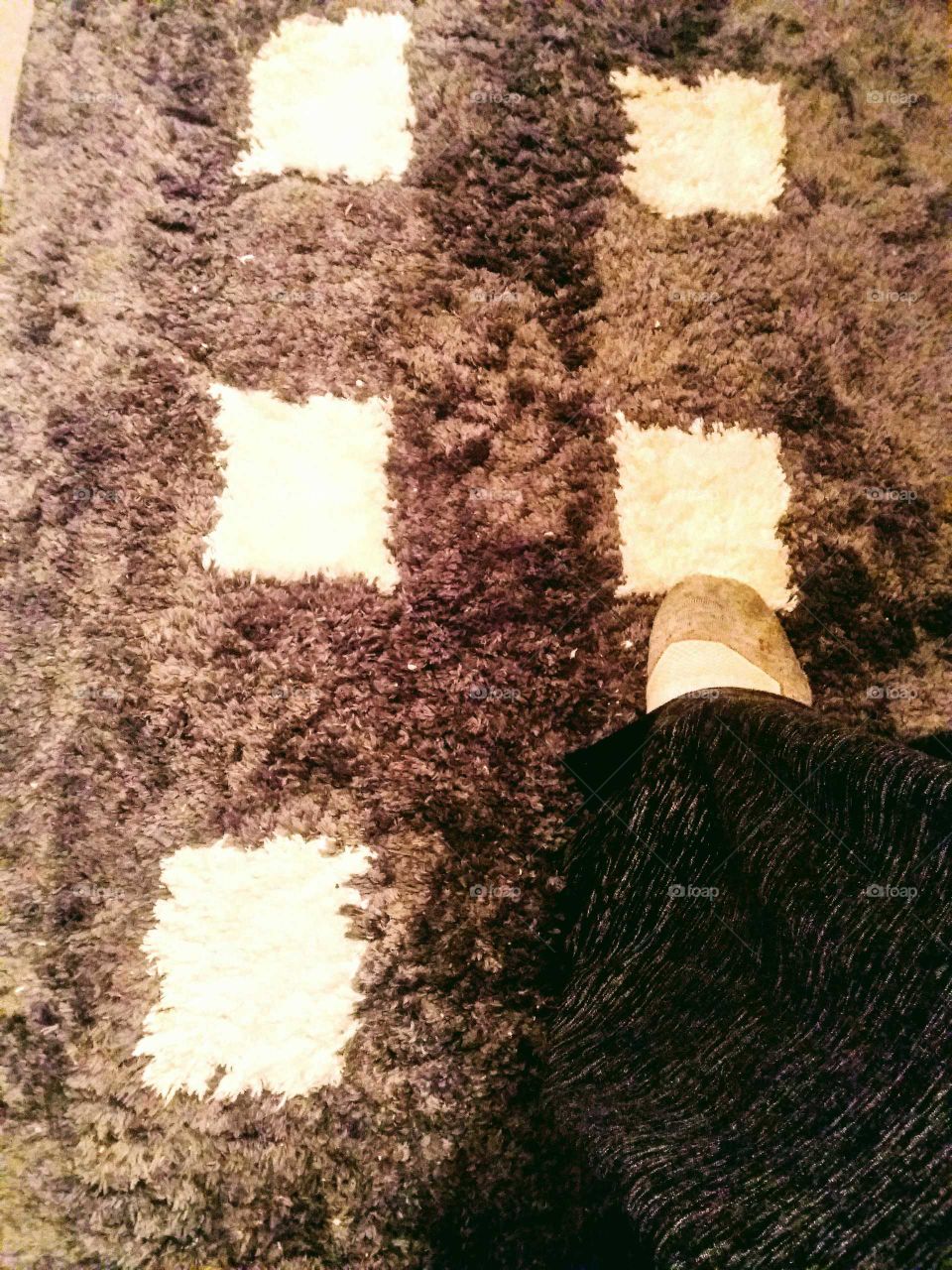 foot on fluffy carpet