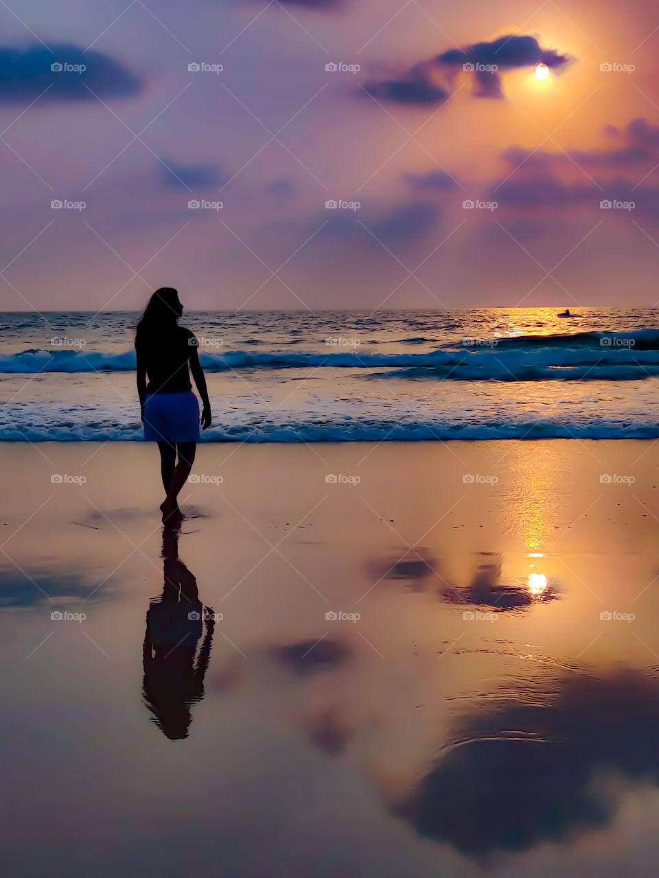 shadow of woman silhouette enjoying sunset on the beach..😍